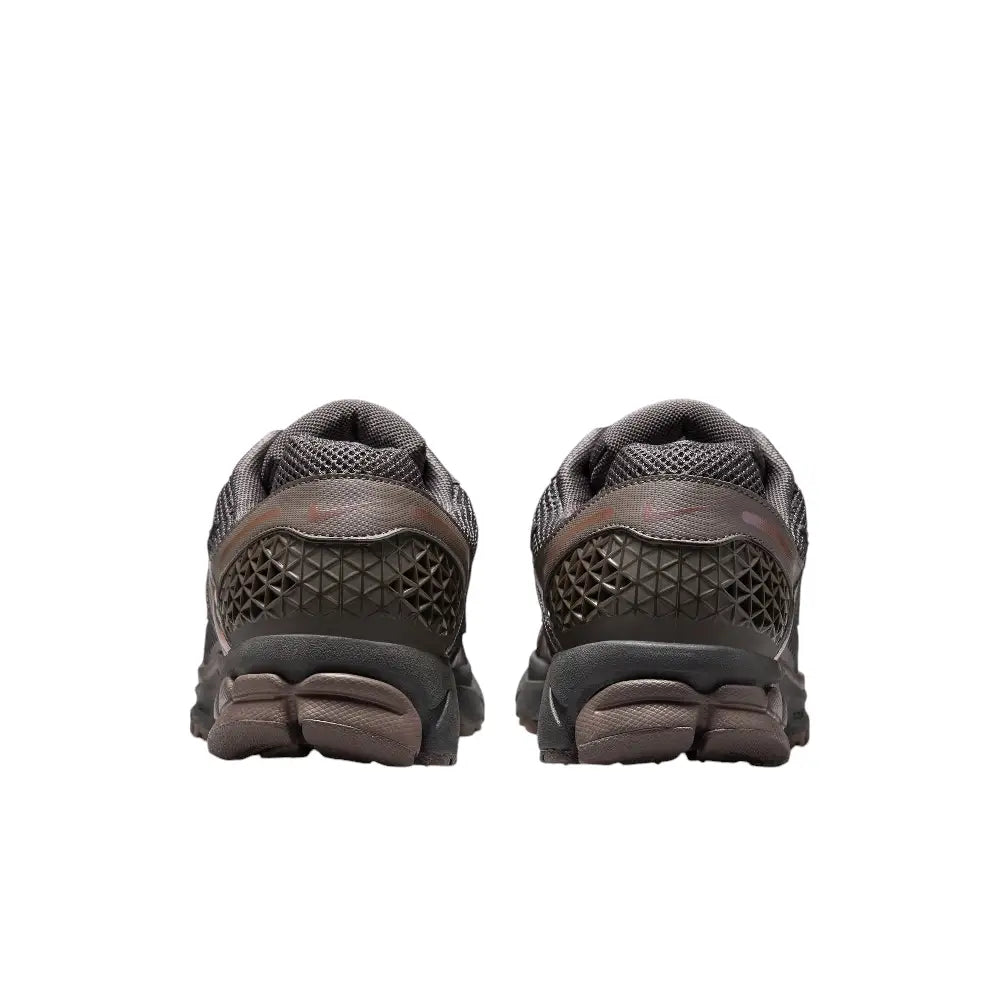 Back view of Nike Zoom Vomero 5 Cave Stone shoes showcasing sleek design and durable material.