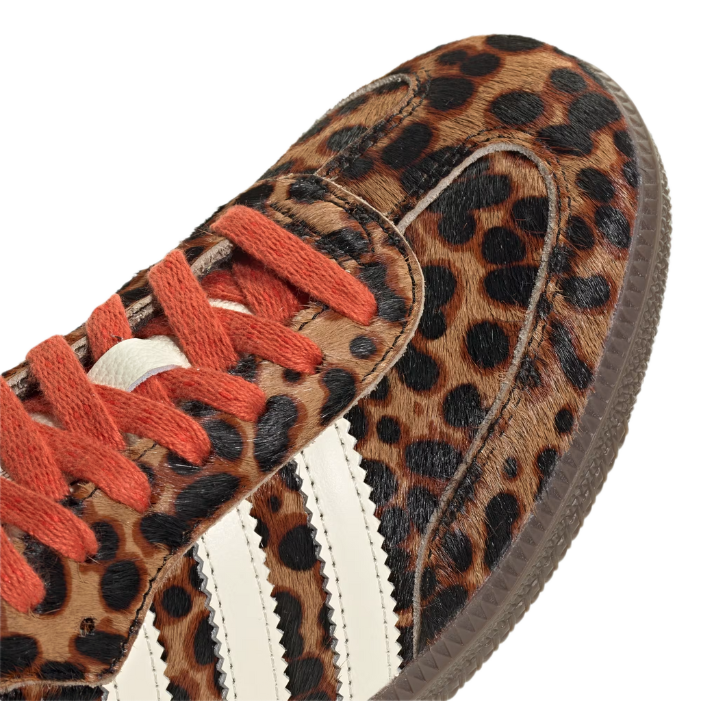 Samba Og Preloved Red Leopard shoe with leopard print upper and red laces, designed by Adidas.